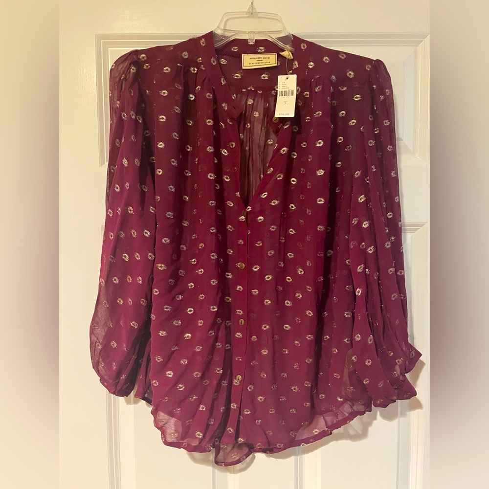 New with tags burgundy loose fitting top.  Wear over a shell or bodysuit.